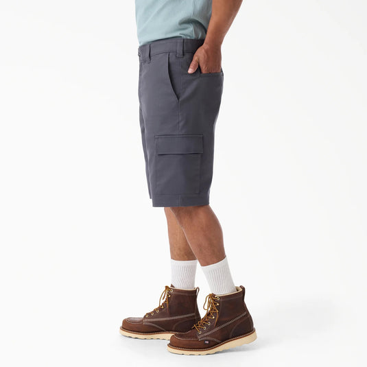 Person wearing gray cargo shorts with pockets, white socks, and brown boots on a white background