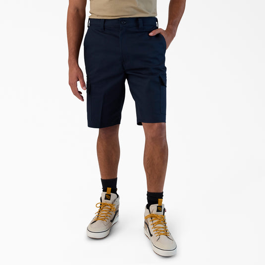 Person wearing navy cargo shorts on a white background