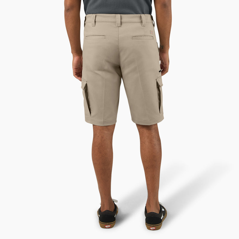 Load image into Gallery viewer, Beige cargo shorts worn by a person on a white background
