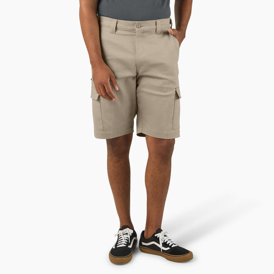 Person wearing beige cargo shorts on a white background