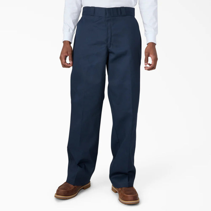 Load image into Gallery viewer, Navy loose fit work pants worn by a person on a white background
