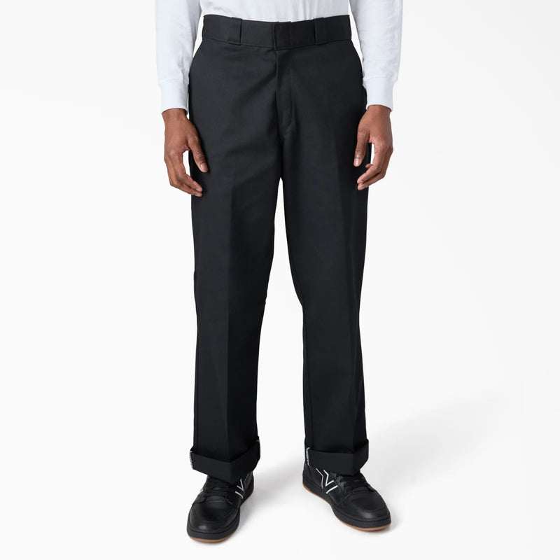 Load image into Gallery viewer, Black loose fit work pants worn by a person on a white background
