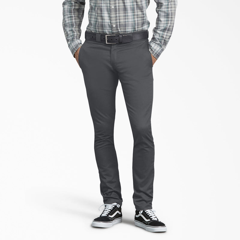 Load image into Gallery viewer, Person wearing gray Dickies pants on a white background.
