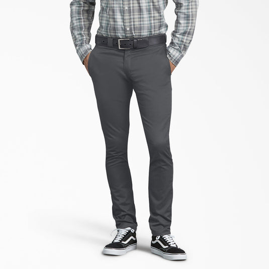 Person wearing gray Dickies pants on a white background.