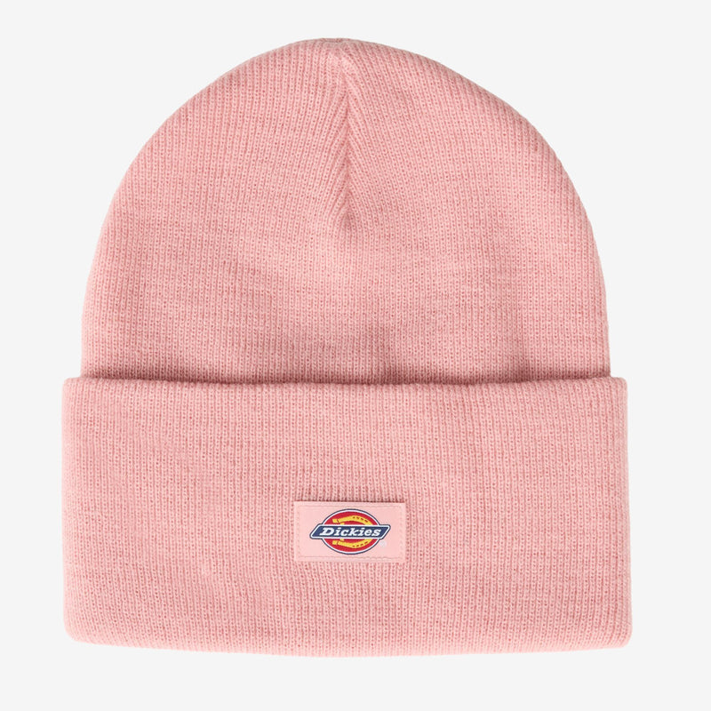 Load image into Gallery viewer, A light pink knit beanie hat with a folded cuff and a small Dickies logo patch on the front, shown against a plain light gray background.
