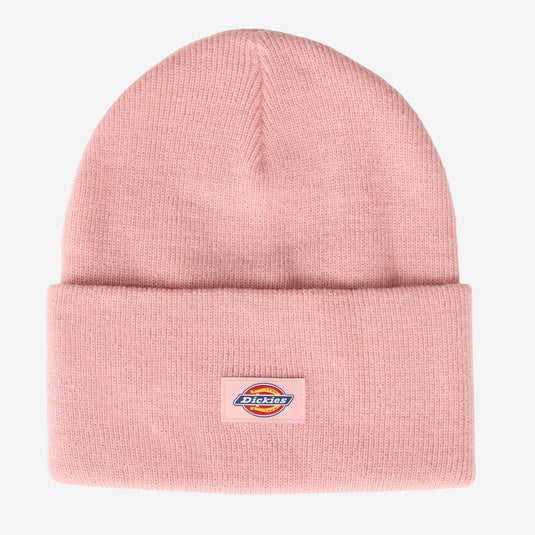 A light pink knit beanie hat with a folded cuff and a small Dickies logo patch on the front, shown against a plain light gray background.