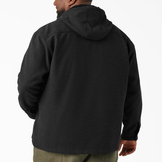 Man wearing a black hooded jacket from behind on a white background