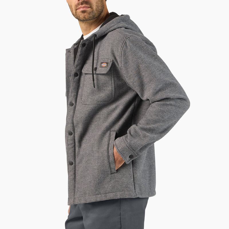 Load image into Gallery viewer, Side profile of Man wearing a gray hooded snap on jacket on a white background
