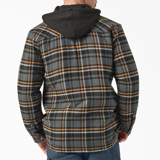Man wearing a plaid jacket with a hood on a white background