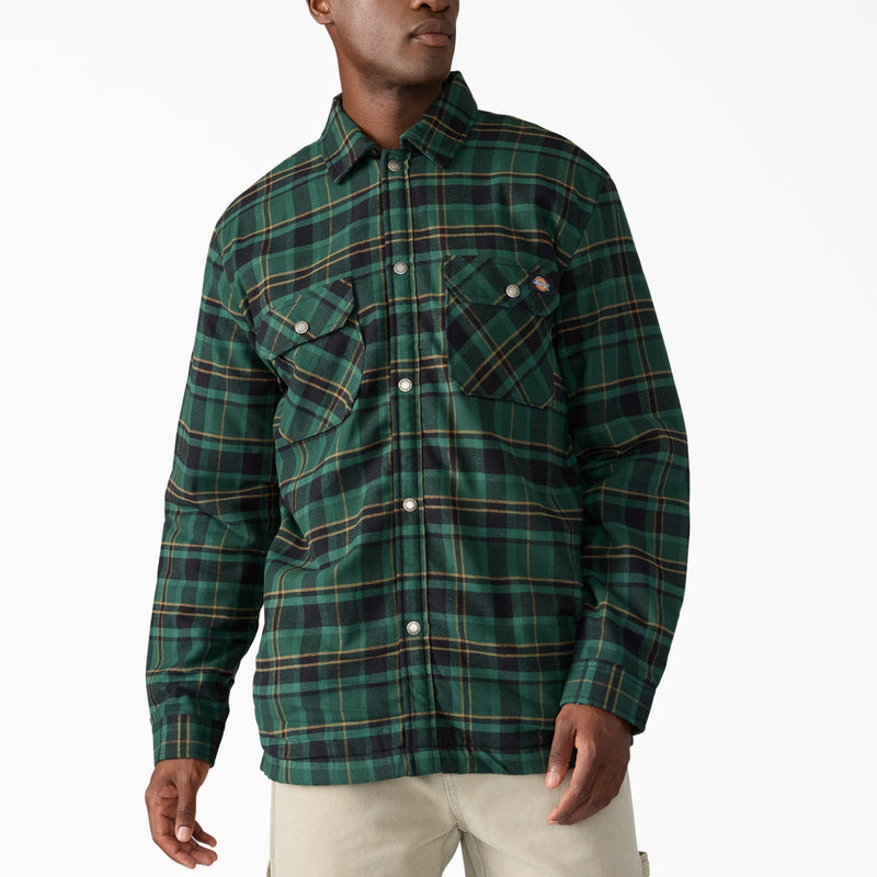 Load image into Gallery viewer, Man wearing a green plaid shirt on a white background
