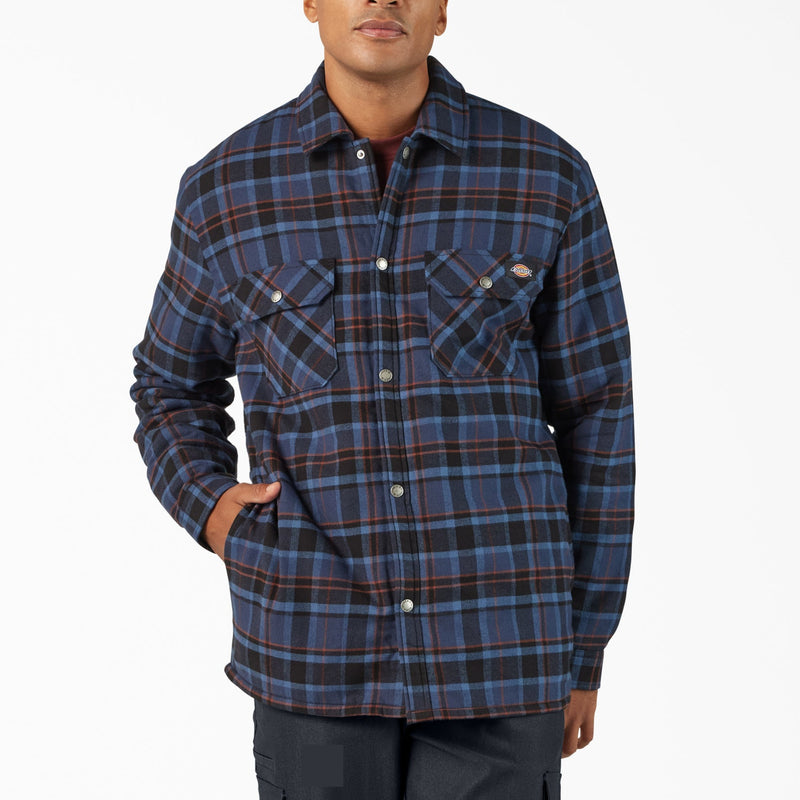 Load image into Gallery viewer, Man wearing a blue and brown plaid shirt on a white background
