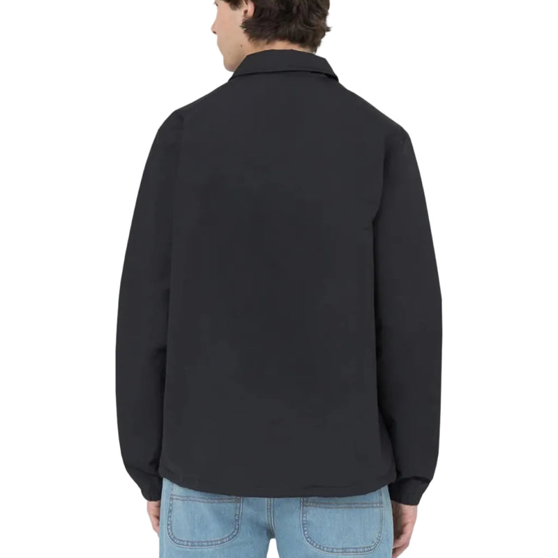 Load image into Gallery viewer, Person wearing a black coaches jacket on a white background
