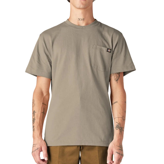 Man wearing a beige t-shirt with a logo on a white background