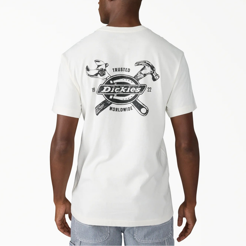 Load image into Gallery viewer, A man viewed from the back wearing a white Dickies t-shirt with a large black graphic on the back, paired with light blue denim jeans, against a plain white background.
