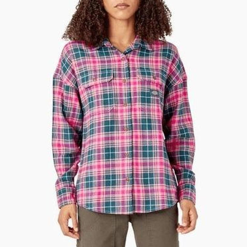 Load image into Gallery viewer, A woman modeling a long-sleeve button-up plaid shirt in pink, teal, and green, paired with olive pants, against a plain white background.
