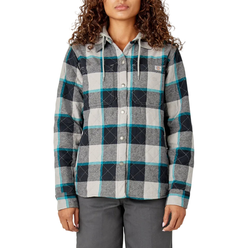 Load image into Gallery viewer, Woman wearing a plaid shirt with a visible brand logo on a white background
