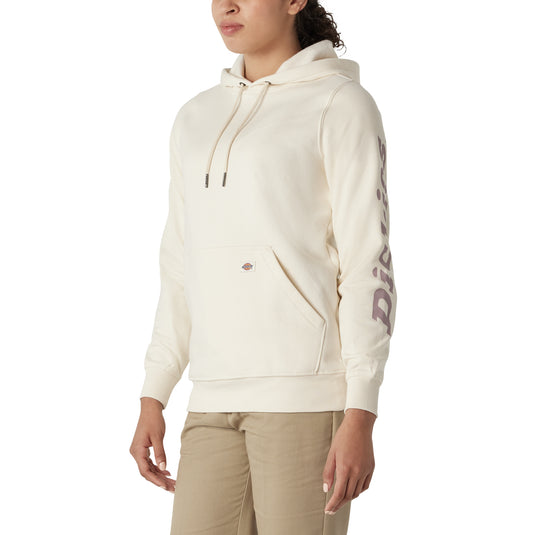 Person wearing a cream hoodie with a brand logo on a white background