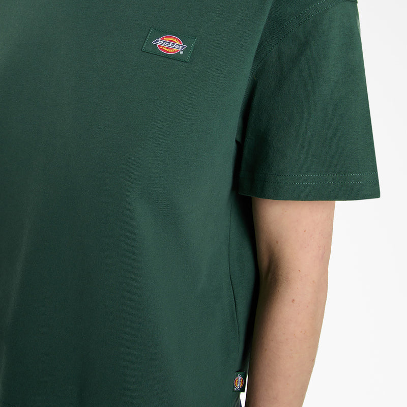 Load image into Gallery viewer, Close up of a female model wearing a pine needle green Oakport Short Sleeve T-Shirt features a boxy, cropped fit that pairs perfectly with high-rise shorts or jeans.
