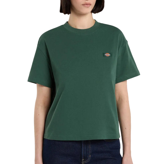 A female model wearing a pine needle green Oakport Short Sleeve T-Shirt features a boxy, cropped fit that pairs perfectly with high-rise shorts or jeans.