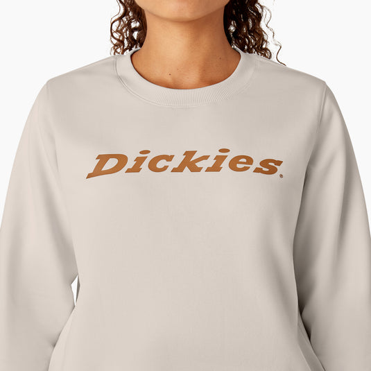 This off white cream heavyweight fleece crewneck sweatshirt features a relaxed fit, shorter length that falls just below the waist, and the "Dickies" logo on the front center chest.