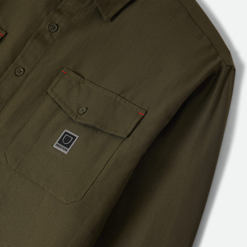 Load image into Gallery viewer, Dark olive green long sleeve shirt with a pocket and small brixton patch logo 
