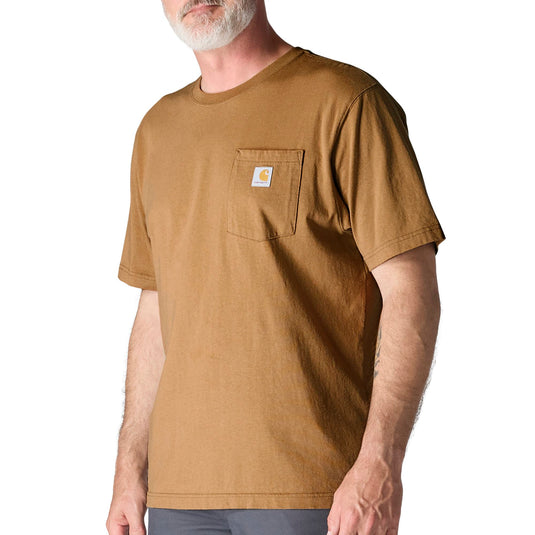 Man wearing a brown t-shirt with a Carhartt logo on the left chest pocket 