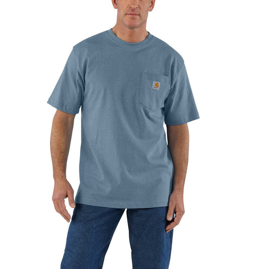 Man wearing a blue t-shirt with a Carhartt logo on the left chest pocket