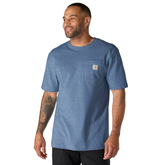 Man wearing a blue t-shirt with a visible brand Carhartt logo on left chest pocket