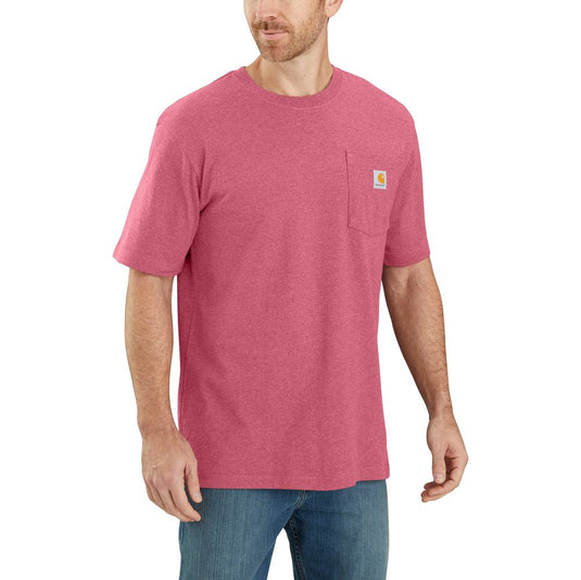 Man wearing a heather pink t-shirt with a visible Carhartt brand logo on the left chest pocket