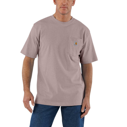 Man wearing a muted pink t-shirt with a Carhartt logo on the left chest pocket 