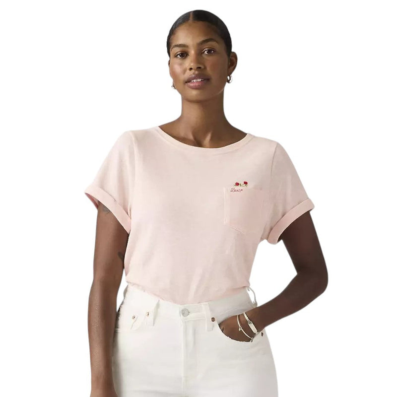 Load image into Gallery viewer, Woman wearing a light pink t-shirt with a floral embroidery over the left chest pocket. 
