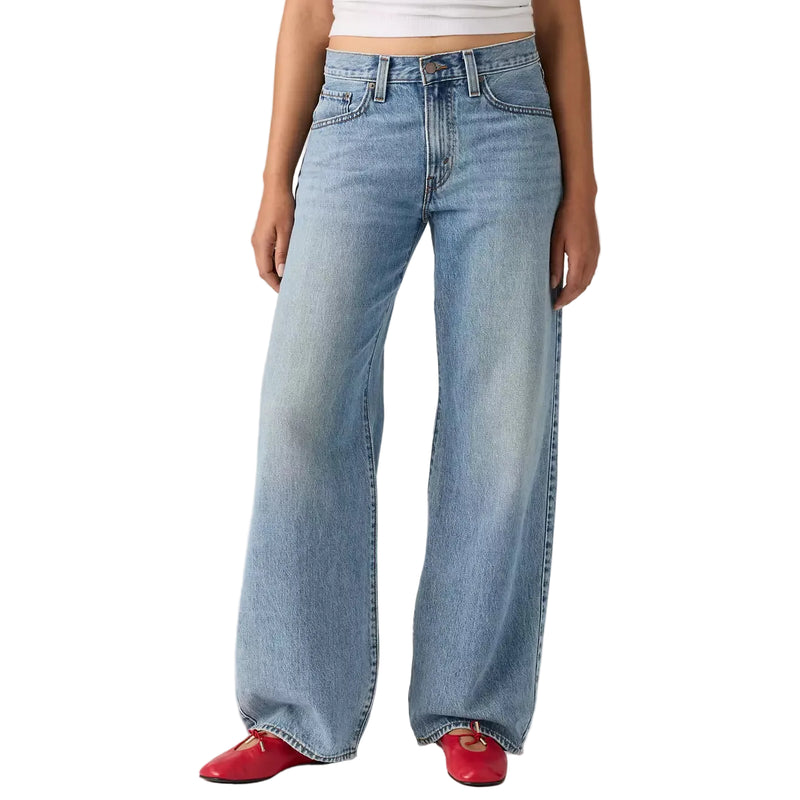 Load image into Gallery viewer, Person wearing light blue wide-leg jeans with a plain background
