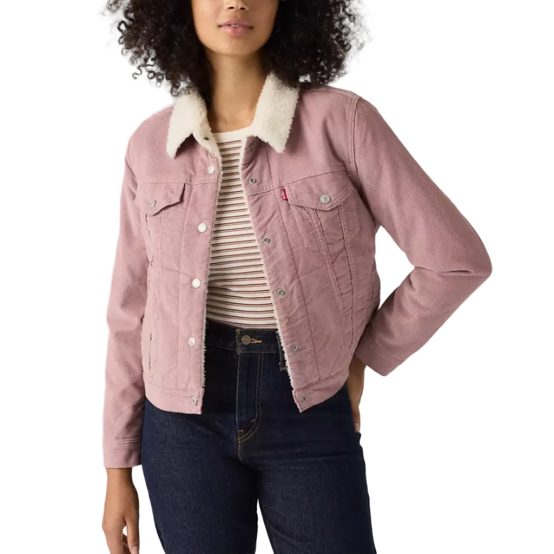 Load image into Gallery viewer, A woman modeling a dusty pink corduroy jacket with a cream sherpa collar, worn over a striped t-shirt and dark blue jeans against a white studio background.
