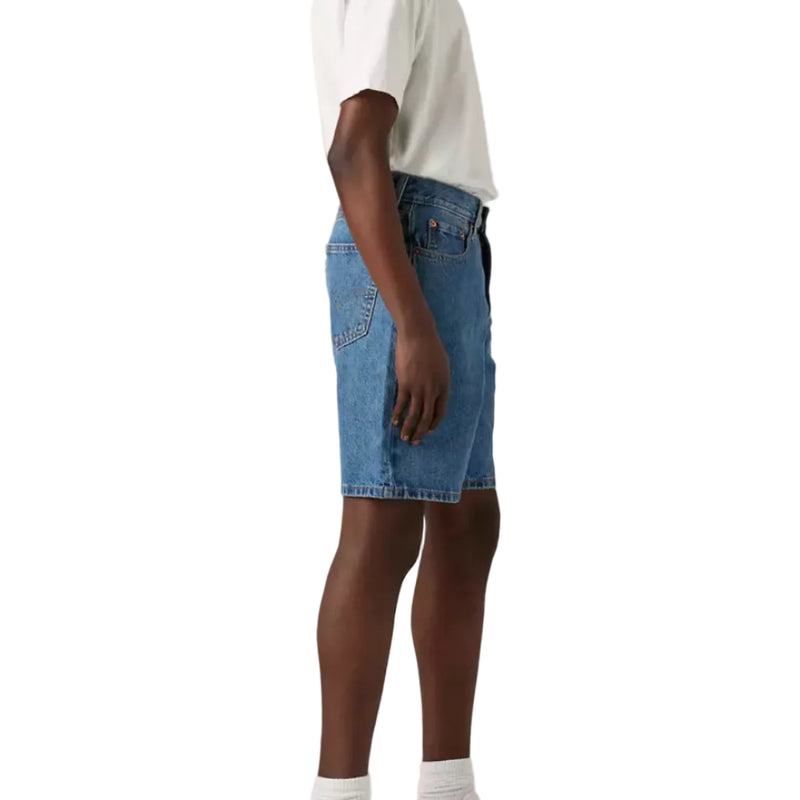Load image into Gallery viewer, Person wearing a white t-shirt and blue denim shorts on a plain background
