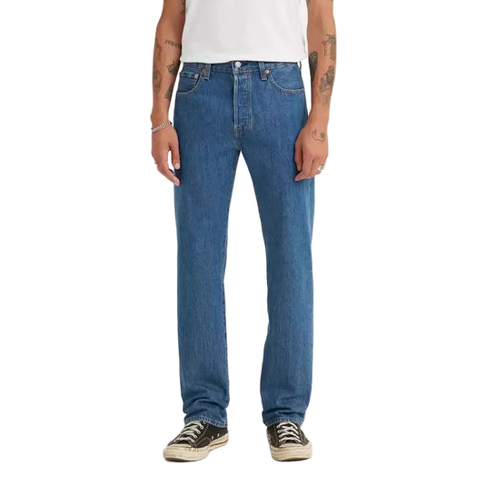 Man wearing a white t-shirt with the Levis 501 Original Medium Stonewash jeans