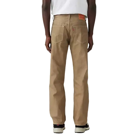 Person wearing a white t-shirt and beige pants on a plain background