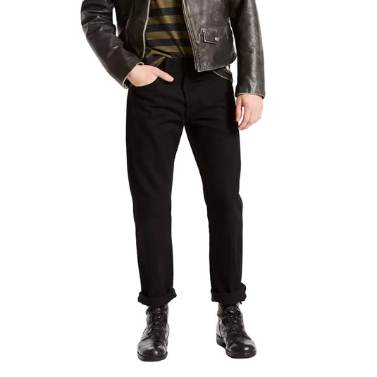 Man wearing a leather jacket, striped shirt, and black pants on a white background