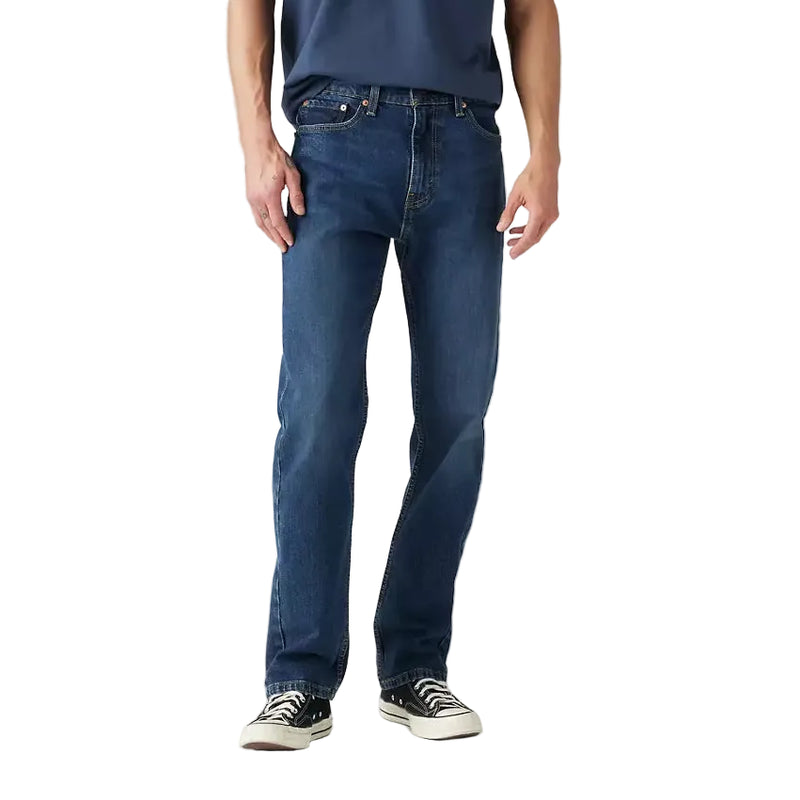 Load image into Gallery viewer, Man wearing a navy t-shirt and blue jeans on a light gray background
