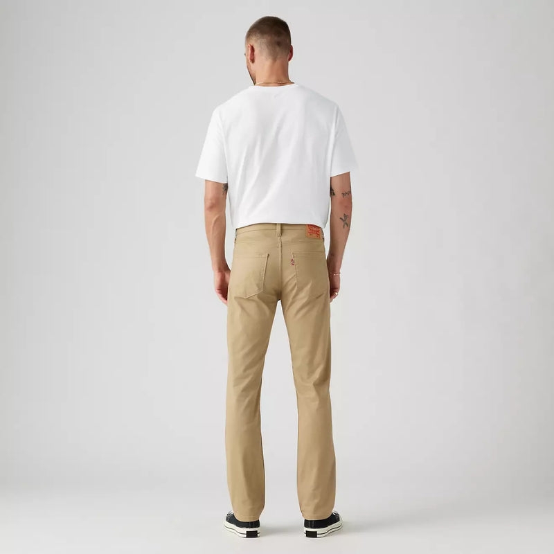 Load image into Gallery viewer, Man wearing a white t-shirt and beige pants on a plain background
