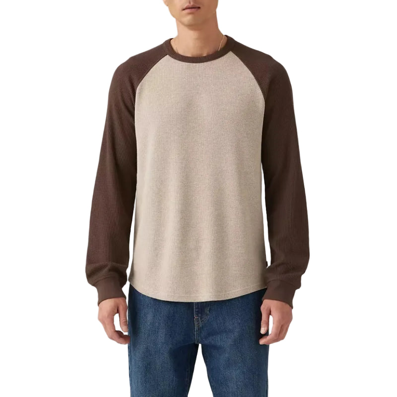 Load image into Gallery viewer, Man wearing a brown and beige long-sleeve thermal shirt with blue jeans on a plain background
