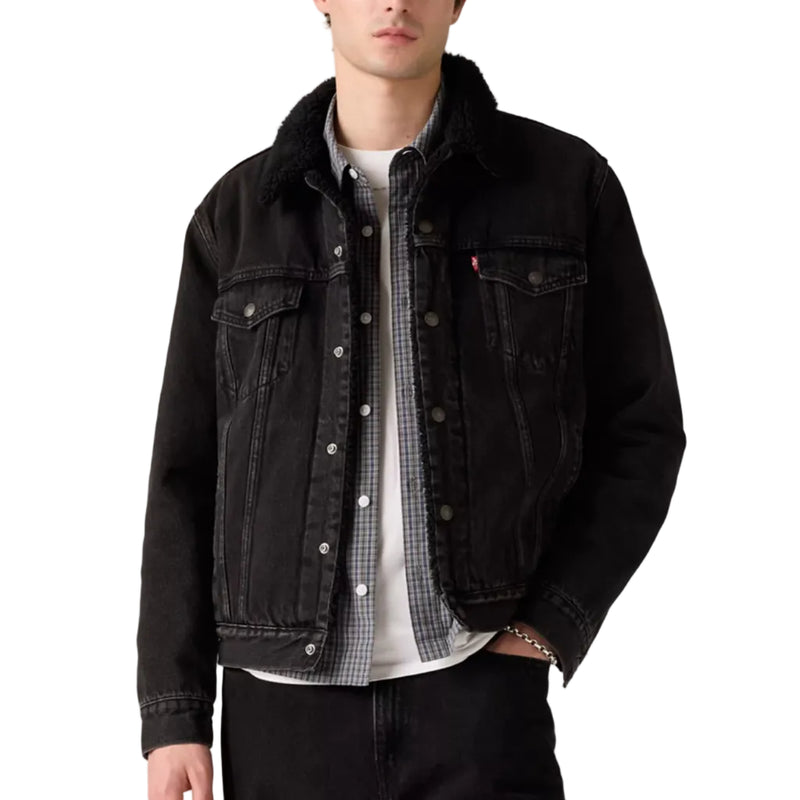 Load image into Gallery viewer, Man wearing a black denim jacket over a checkered shirt on a plain background
