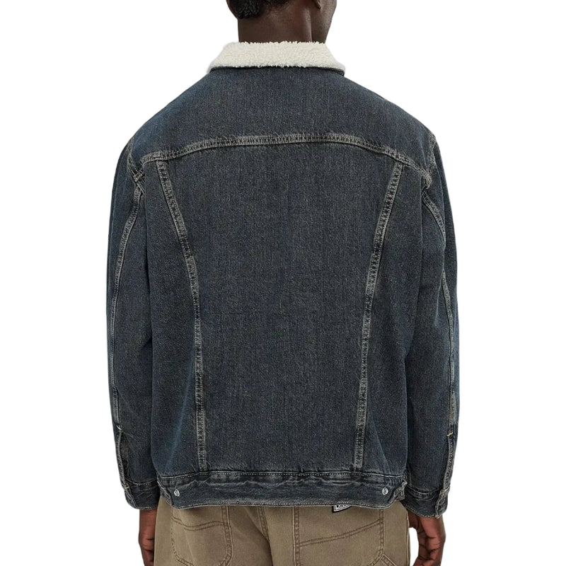 Load image into Gallery viewer, A person shown from the back wearing a dark washed denim jacket with a white sherpa collar, paired with tan pants, against a plain white background.
