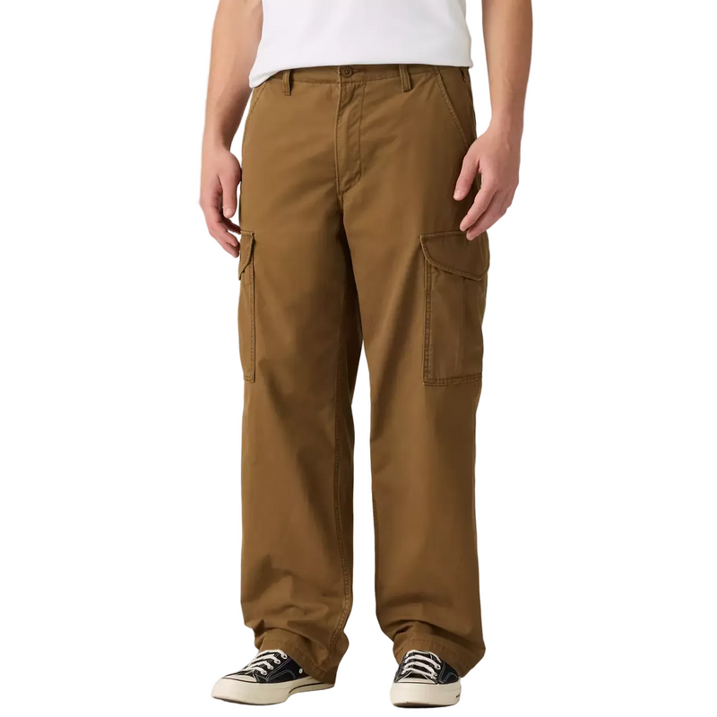 Load image into Gallery viewer, Person wearing dark brown Levis Cargo pants on a white background.
