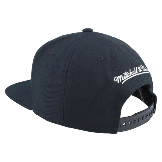 A black flat-brim snapback cap shown from a three-quarter back angle, featuring white embroidered 'Mitchell & Ness' branding on the side and a black adjustable snapback strap.