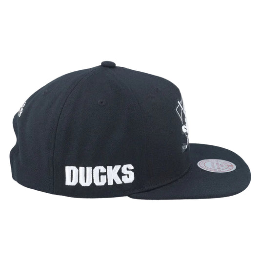 A black flat-brim snapback cap with 'DUCKS' embroidered in white block letters on the side, shown against a plain white background.