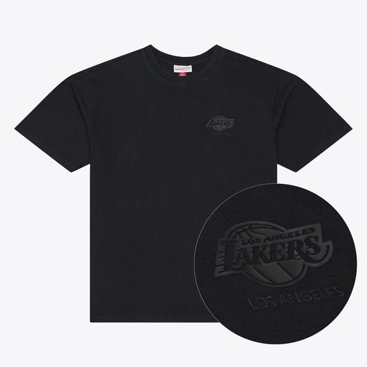 A black short-sleeve crewneck t-shirt featuring a tonal black Los Angeles Lakers logo on the left chest, with a circular inset detail showing the tonal logo texture.