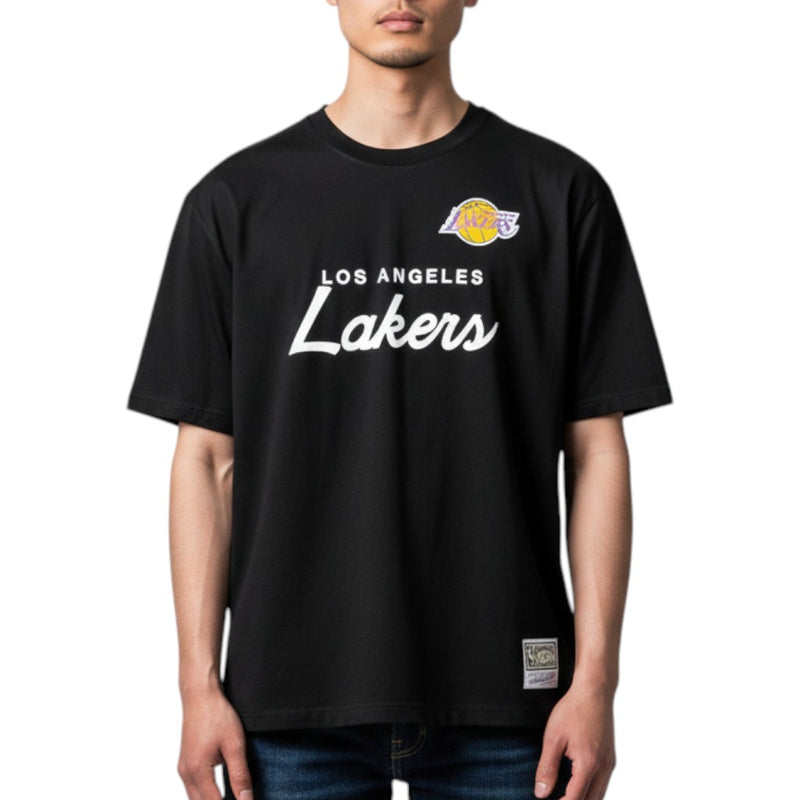 Load image into Gallery viewer, Person wearing a black 'Los Angeles Lakers' shirt with the Lakers logo on a white background. 

