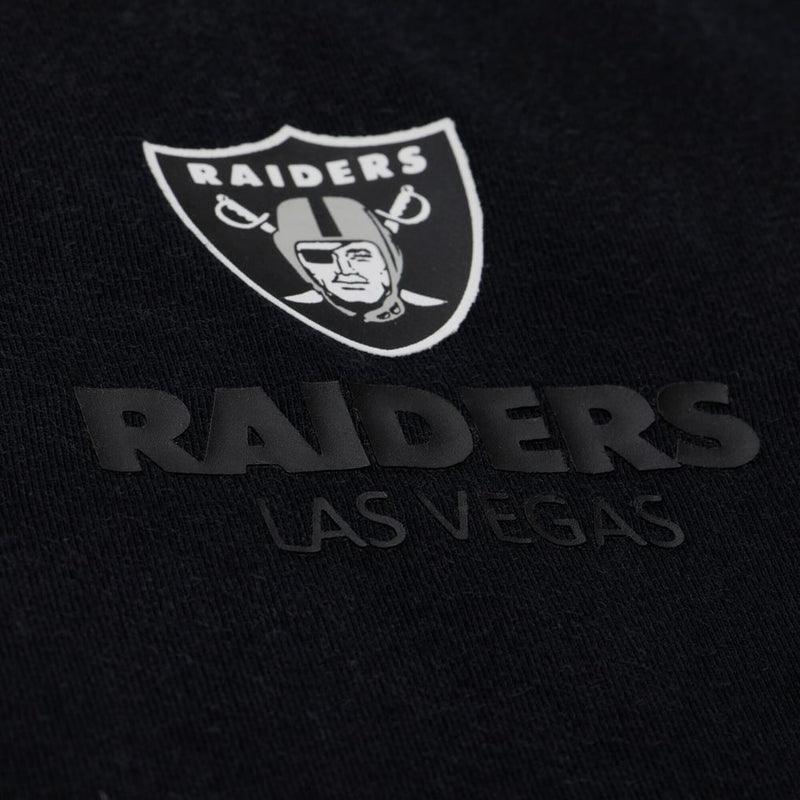 Load image into Gallery viewer, Closeup shot of a the Raiders Logo and team name printed on the Mitchell &amp; Ness Core Essentials tee
