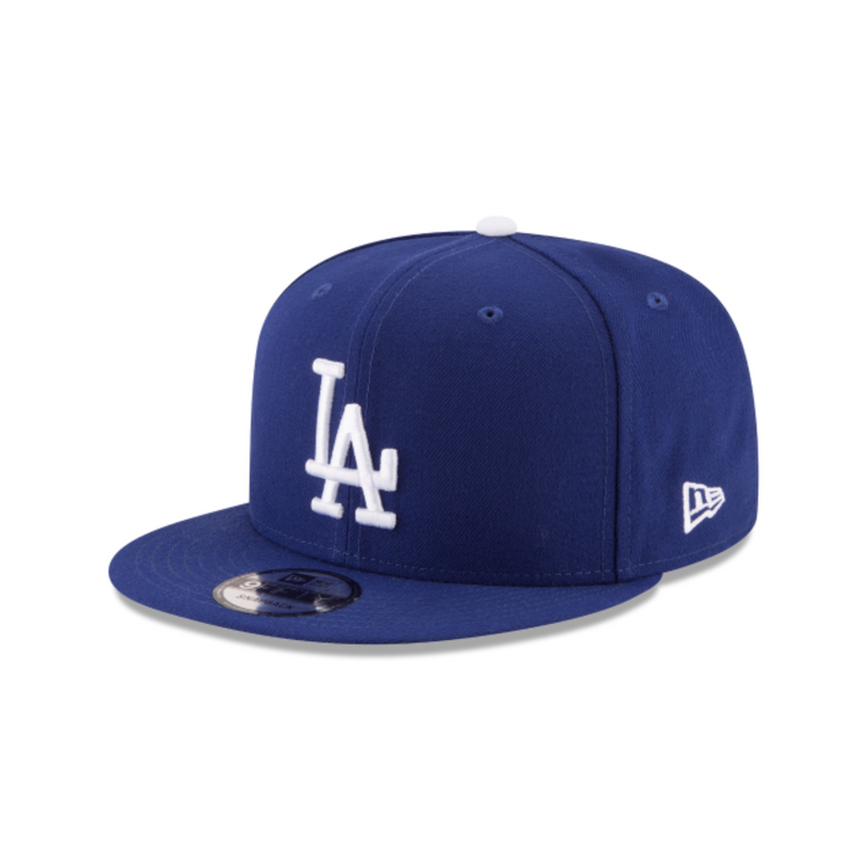Load image into Gallery viewer, Blue baseball cap with white logo on a white background
