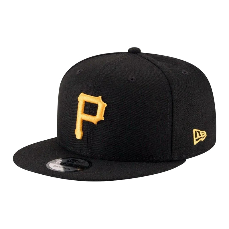 Load image into Gallery viewer, A black flat-brim baseball cap with a gold embroidered Pittsburgh Pirates 'P' logo on the front and a gold New Era flag logo on the side, shown on a white background.
